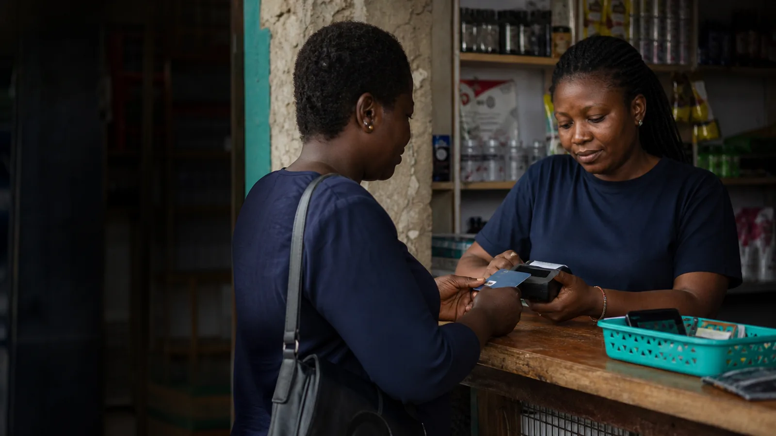 A market trader completing a payment on a handset.